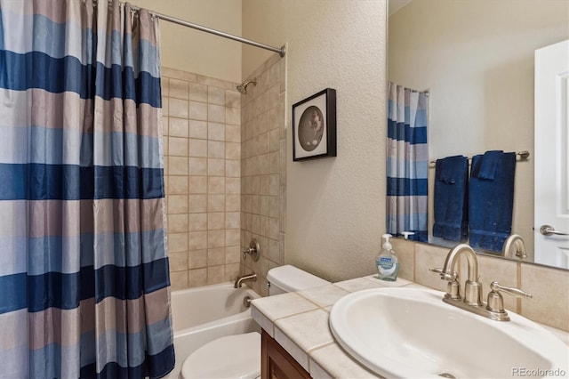 8714 E 148th Cir, Thornton, CO 80602 - bathroom featuring a textured wall, shower / tub combo, vanity, and toilet