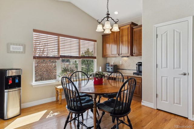 8714 E 148th Cir, Thornton, CO 80602 - dining space featuring baseboards, an inviting chandelier, light wood-type flooring, recessed lighting, and vaulted ceiling