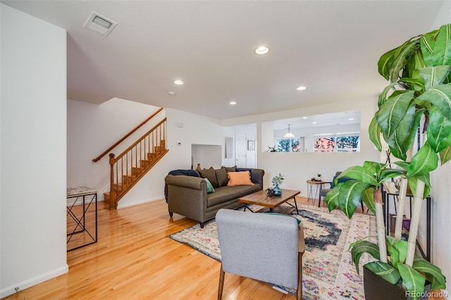 living room with light hardwood / wood-style floors