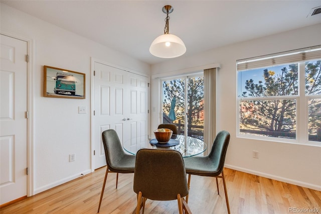 dining area with hardwood / wood-style floors