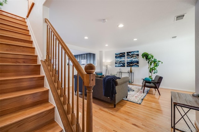 living room with light hardwood / wood-style flooring