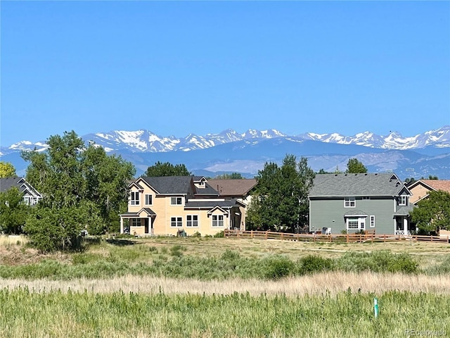 back of property with a mountain view