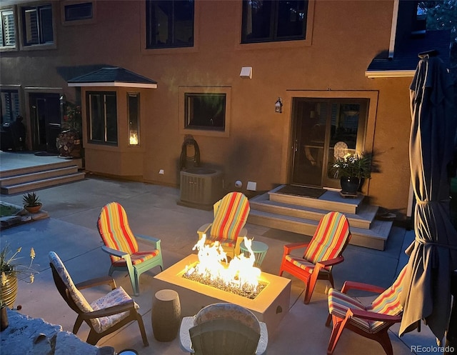 85 S Sherwood Gln, Monument, CO 80132 - view of patio with an outdoor fire pit and central AC unit