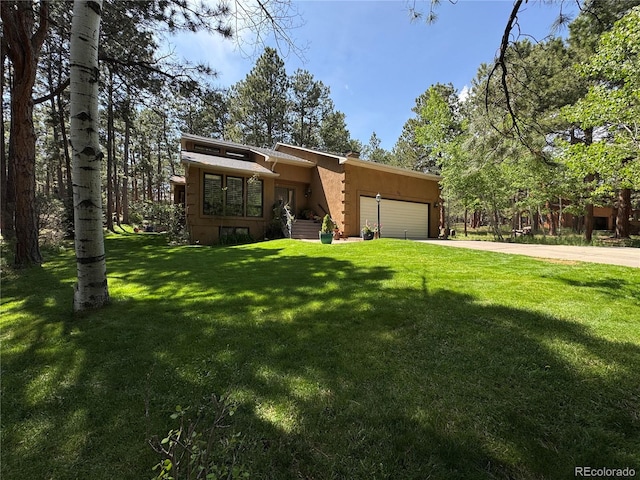 85 S Sherwood Gln, Monument, CO 80132 - mid-century home featuring a garage, a front lawn, and concrete driveway
