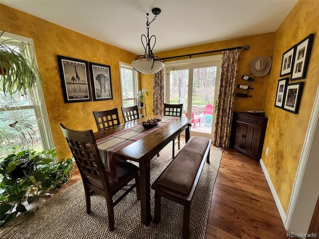 85 S Sherwood Gln, Monument, CO 80132 - dining space featuring wood finished floors, baseboards, and a textured wall