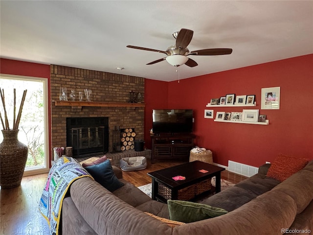 85 S Sherwood Gln, Monument, CO 80132 - living area with a ceiling fan, wood finished floors, and a brick fireplace