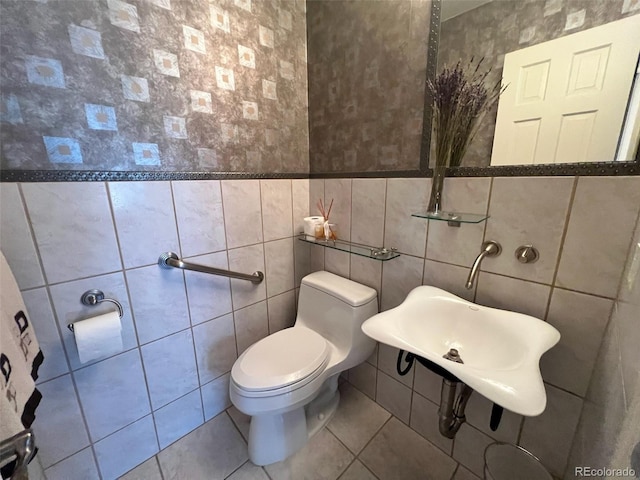 85 S Sherwood Gln, Monument, CO 80132 - half bathroom featuring tile walls, toilet, and tile patterned floors