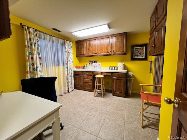 85 S Sherwood Gln, Monument, CO 80132 - home office with light tile patterned floors and built in desk