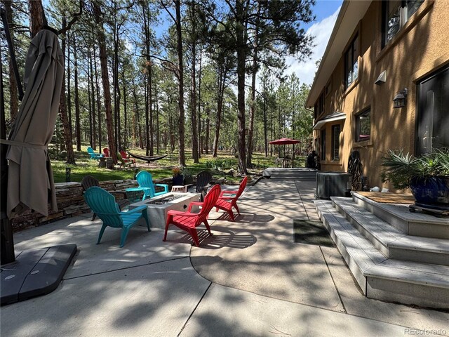 85 S Sherwood Gln, Monument, CO 80132 - view of patio with a fire pit