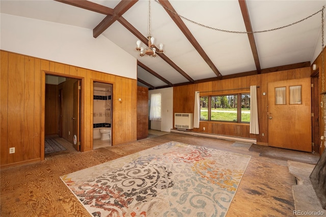 23976 County Rd 50, Fraser, CO 80442 - unfurnished living room featuring wooden walls, a chandelier, a baseboard heating unit, and heating unit