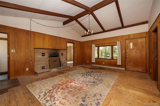 23976 County Rd 50, Fraser, CO 80442 - unfurnished living room featuring wooden walls, baseboard heating, beamed ceiling, wood finished floors, and a chandelier