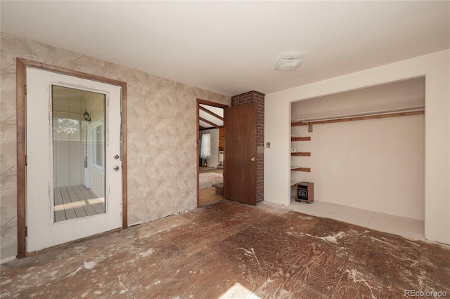 23976 County Rd 50, Fraser, CO 80442 - unfurnished bedroom with a closet and wallpapered walls