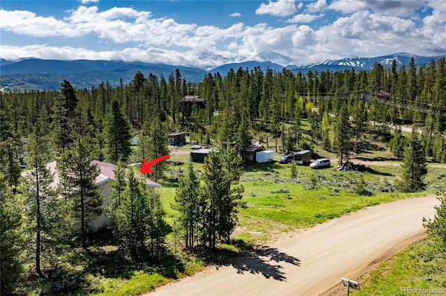23976 County Rd 50, Fraser, CO 80442 - mountain view featuring a heavily wooded area