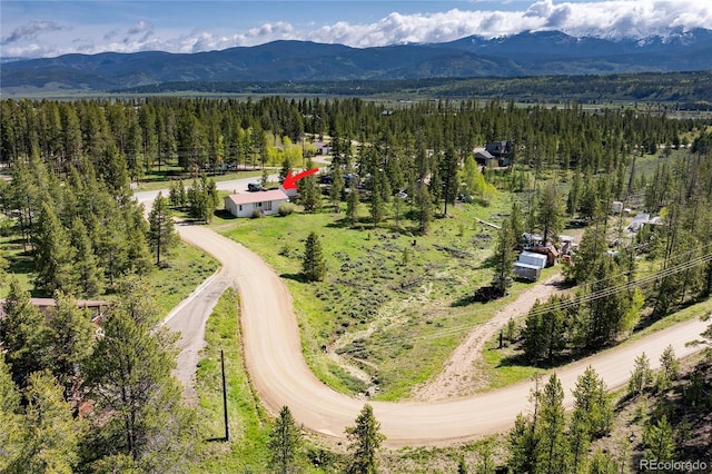 23976 County Rd 50, Fraser, CO 80442 - drone / aerial view of a heavily wooded area and a mountainous background
