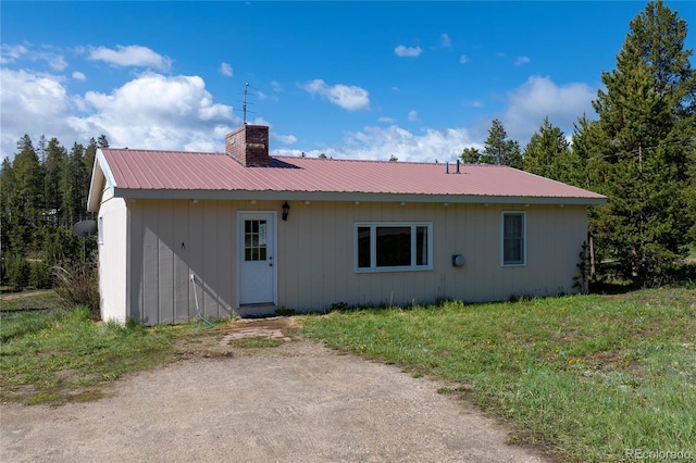23976 County Rd 50, Fraser, CO 80442 - back of house featuring a chimney and metal roof