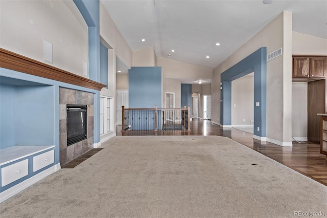 unfurnished living room with dark wood finished floors, recessed lighting, visible vents, a tile fireplace, and baseboards