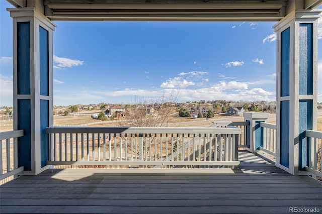 wooden terrace featuring a residential view