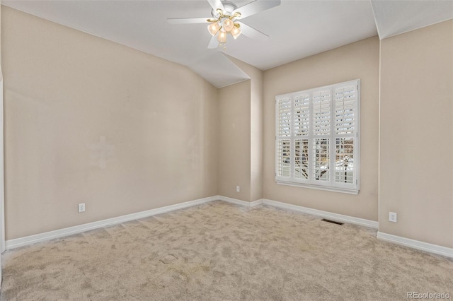 unfurnished room featuring ceiling fan, baseboards, visible vents, and light colored carpet