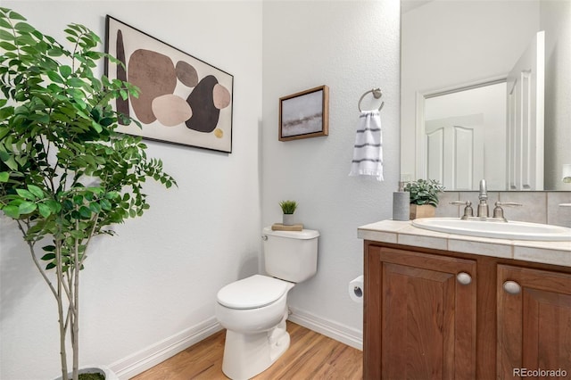 8802 E 148th Ln, Thornton, CO 80602 - half bath featuring vanity and wood finished floors