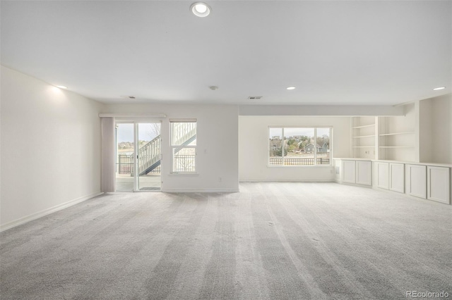 8802 E 148th Ln, Thornton, CO 80602 - empty room featuring plenty of natural light, light carpet, and recessed lighting