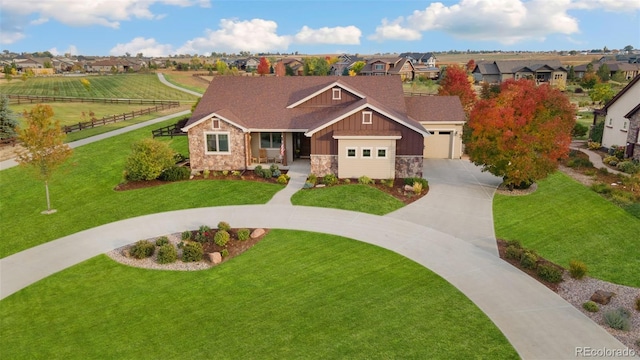 view of front facade featuring a garage and a front lawn