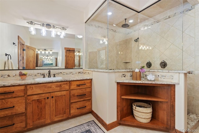 bathroom featuring vanity, backsplash, tile patterned floors, and walk in shower