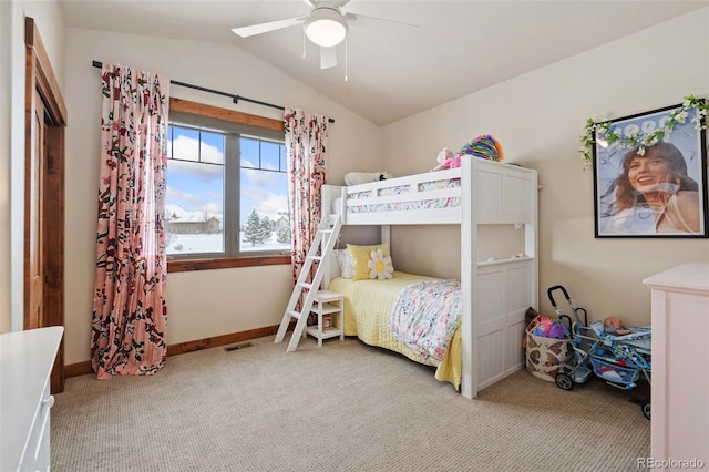 bedroom featuring vaulted ceiling, light carpet, and ceiling fan