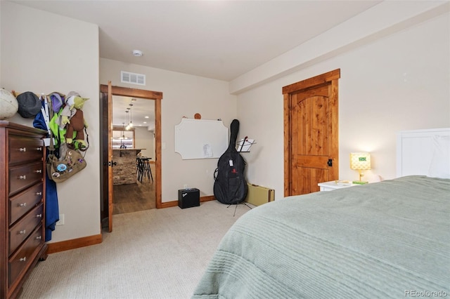 bedroom featuring light colored carpet