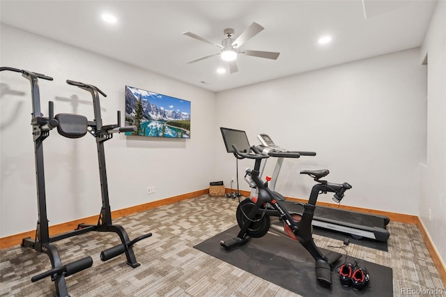 workout area featuring carpet flooring and ceiling fan