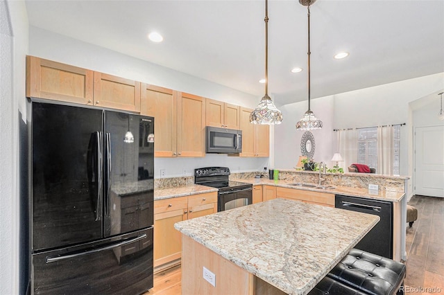 kitchen with black appliances, light brown cabinets, a kitchen island, and sink