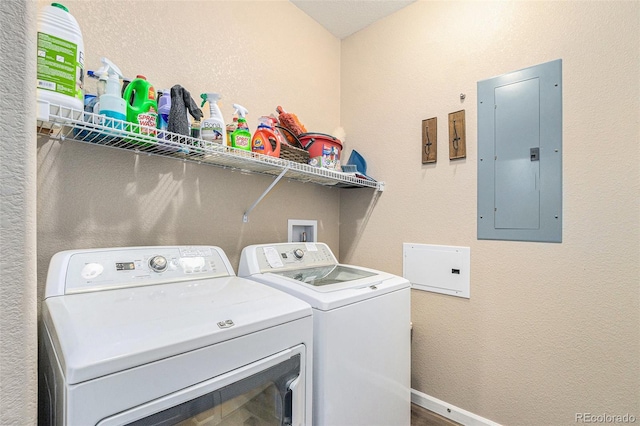 clothes washing area featuring washing machine and dryer and electric panel