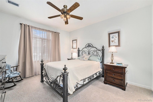 bedroom featuring light carpet and ceiling fan