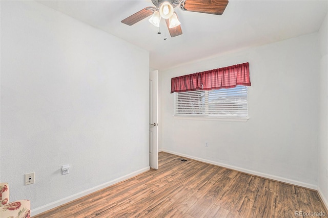 unfurnished room featuring hardwood / wood-style floors and ceiling fan