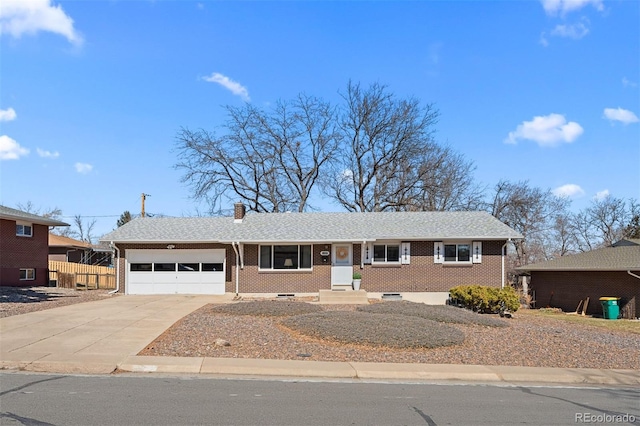 single story home with a garage, brick siding, concrete driveway, and a chimney