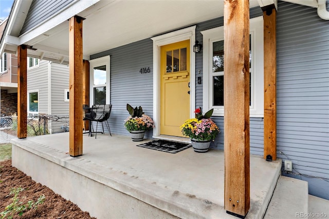 property entrance featuring covered porch