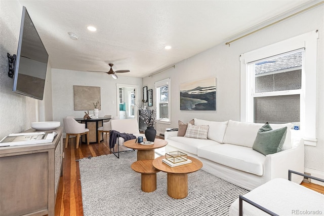 living room with recessed lighting, a healthy amount of sunlight, wood finished floors, and a ceiling fan