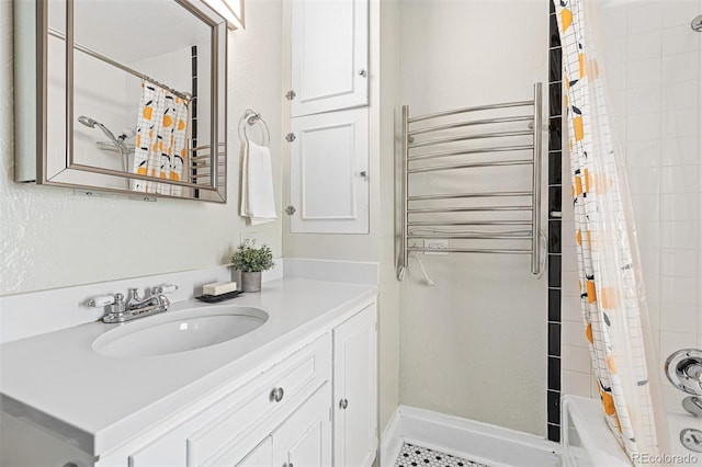 full bath featuring radiator, vanity, shower / tub combo, and baseboards