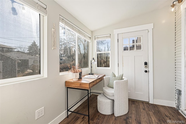 office space featuring baseboards, dark wood-style floors, and vaulted ceiling