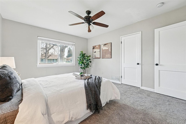 bedroom with baseboards, carpet, and ceiling fan