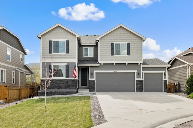 6827 Leilani Ln, Castle Rock, CO 80108 - view of front of house featuring stone siding, concrete driveway, an attached garage, and roof with shingles
