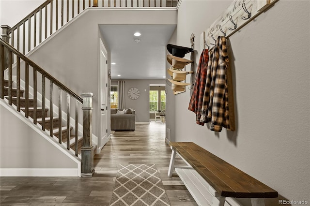 6827 Leilani Ln, Castle Rock, CO 80108 - entryway with wood finished floors, stairway, recessed lighting, baseboards, and a towering ceiling