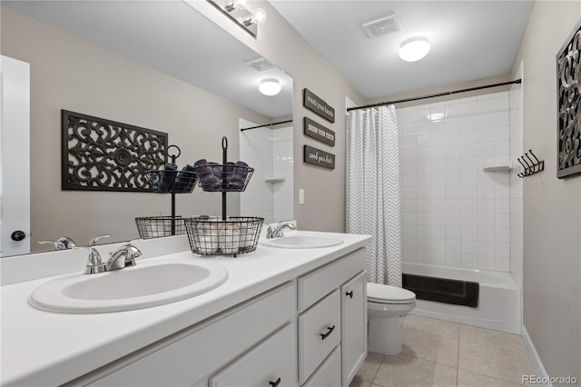 6827 Leilani Ln, Castle Rock, CO 80108 - bathroom with tile patterned flooring, toilet, double vanity, shower / tub combo, and baseboards