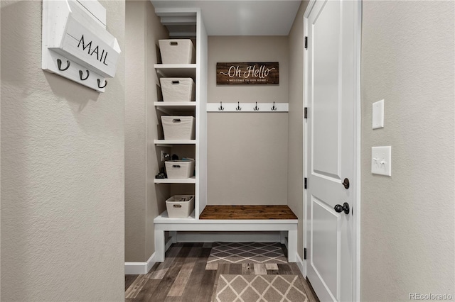 6827 Leilani Ln, Castle Rock, CO 80108 - mudroom with a textured wall, wood finished floors, and baseboards