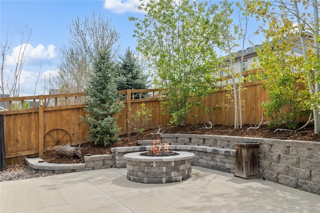 6827 Leilani Ln, Castle Rock, CO 80108 - fenced backyard featuring a patio and an outdoor fire pit