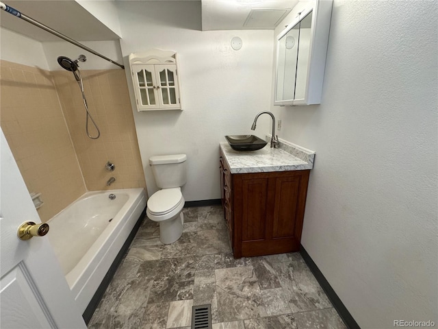 bathroom with visible vents, toilet, vanity, shower / tub combination, and baseboards