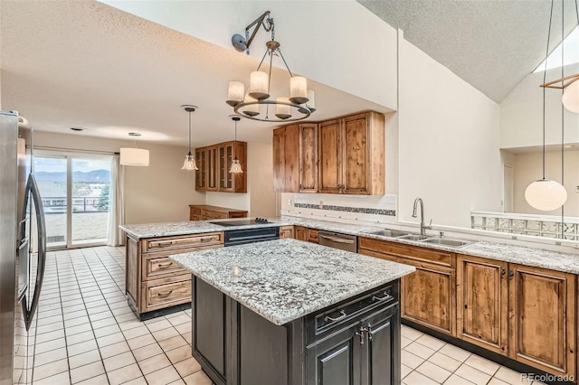 7720 W Quincy Dr, Lakewood, CO 80235 - kitchen featuring brown cabinets, a peninsula, stainless steel appliances, and a sink