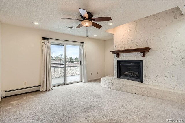 7720 W Quincy Dr, Lakewood, CO 80235 - unfurnished living room featuring visible vents, a ceiling fan, a baseboard heating unit, a textured ceiling, and carpet flooring