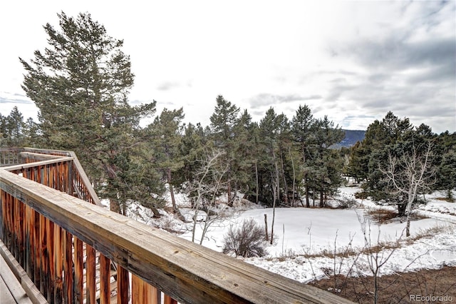 view of snow covered deck