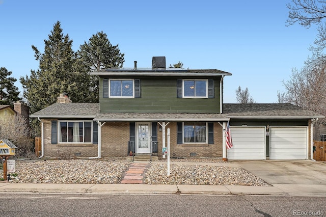 traditional-style home with crawl space, a garage, and brick siding