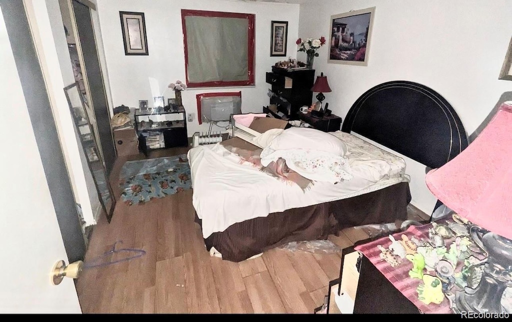 bedroom with wood-type flooring